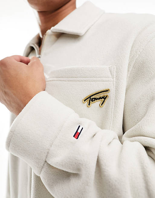 Tommy Jeans relaxed signature logo 1/2 zip fleece in beige | ASOS