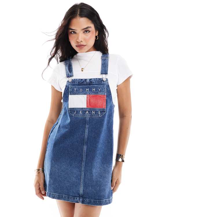 Tommy Jeans retro flag denim dungaree dress in mid wash | ASOS