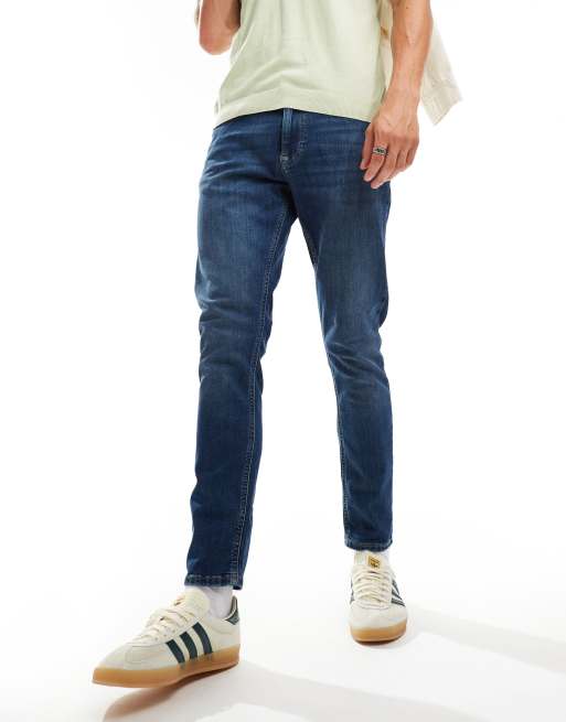 Tommy Jeans – Schmal zulaufende Jeans in Blau mit schmalem Schnitt