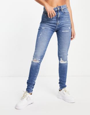 Tommy Jeans super skinny ripped knee jeans in light blue wash | ASOS