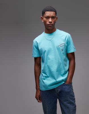 Tommy Jeans – T-Shirt in Grün mit Signatur-Logoprint auf der Rückseite - view 1