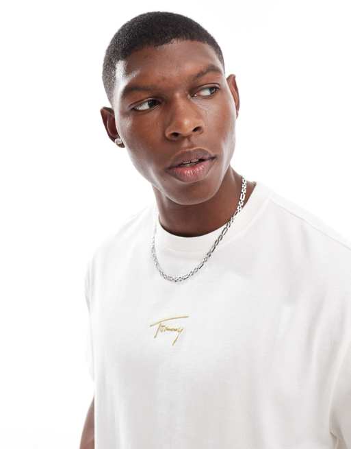 Tommy Jeans - T-shirt met goudkleurig logo in het midden in gebroken wit