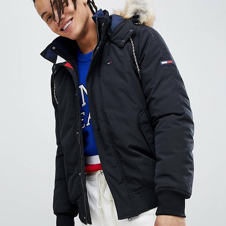 Tommy Jeans technical quilted jacket faux fur trim hood in black | ASOS