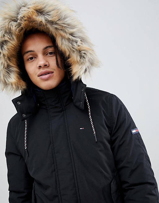 Tommy Jeans technical quilted jacket faux fur trim hood in black | ASOS