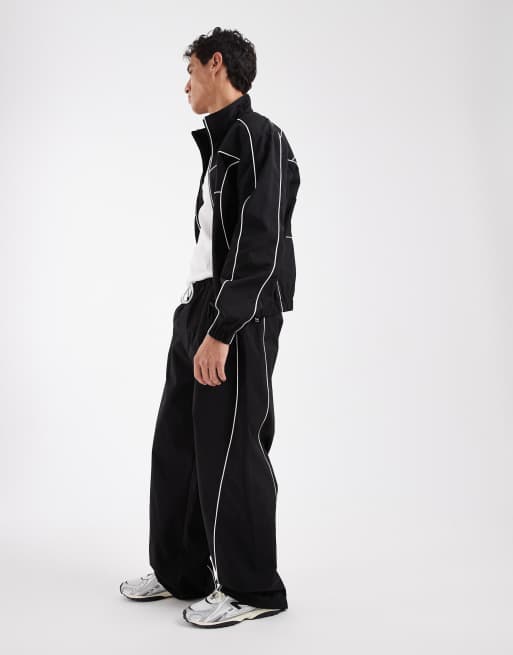 Tommy Jeans Theo piping detail parachute track pants in black , 3 of 5