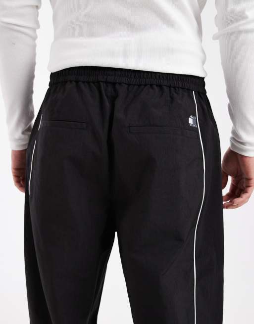 Tommy Jeans Theo piping detail parachute track pants in black , 4 of 5