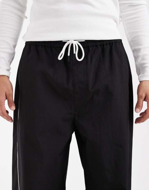 Tommy Jeans Theo piping detail parachute track pants in black , 5 of 5