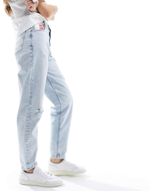 The Kript vintage style mom jeans with distressing and cross over