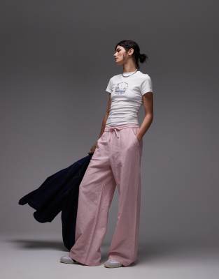 Tommy Jeans - Weite, rosa-weiß gestreifte Hose aus Leinen