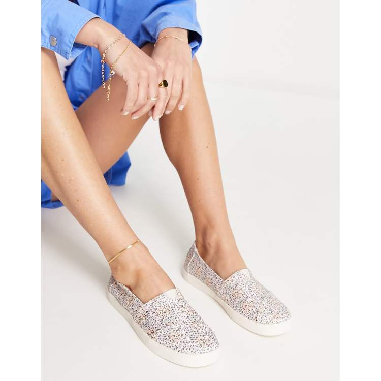 Toms avalon slip on trainers in spot print