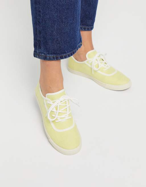 TOMS carmel lace up trainers in yellow