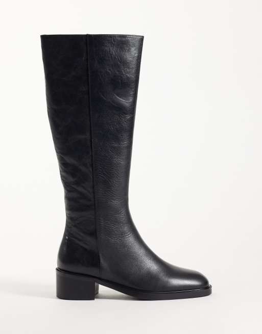 Tony Bianco botas por la rodilla tipo pull on en piel encerada negra, 1 de 4