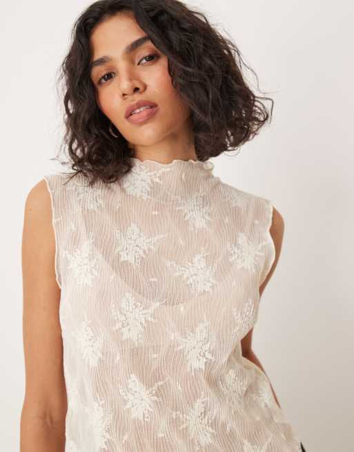 Top blanco hueso sin mangas con cuello alzado de encaje de Gina Tricot