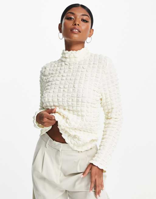 Top color crema con cuello alto de punto de arroz de Selected Femme 