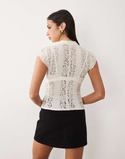 Top color crema con cuello alzado y detalle de lazada de ASOS DESIGN, 2 de 4