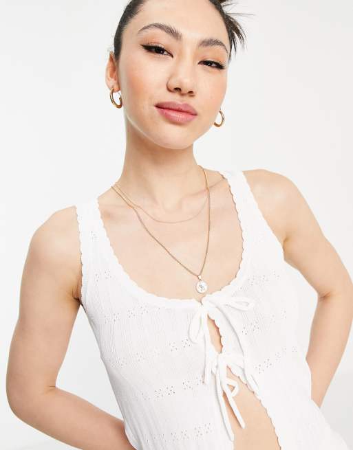 Top color crema de tirantes anudado en la parte delantera de punto de ASOS DESIGN (parte de un conjunto)