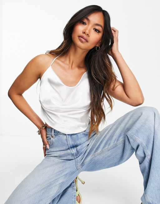 Top color marfil de estilo años 90 con cuello halter, diseño de doble lazada y bajo de pico de ASOS DESIGN