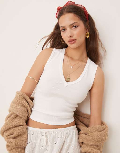Top color marfil sin mangas con cuello de pico Neria de Free People