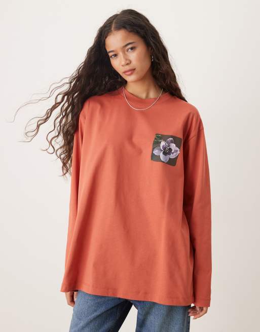Top color óxido extragrande de manga larga con estampado gráfico floral trasero de ASOS DESIGN