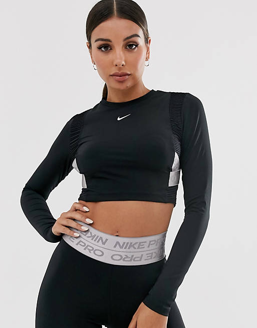 Perth Emoción Insignia Conjunto de leggings y top de manga larga en negro con cinta Pro Training  de Nike | ASOS