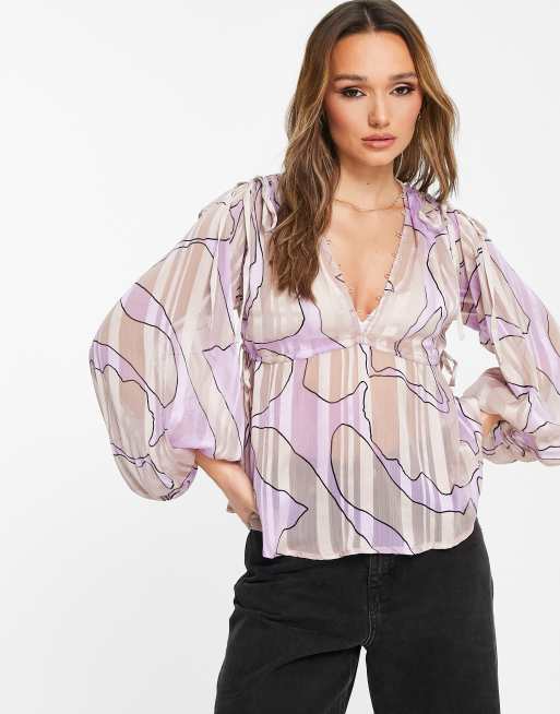 Blusa tejida con lazada, volante y estampado de leopardo