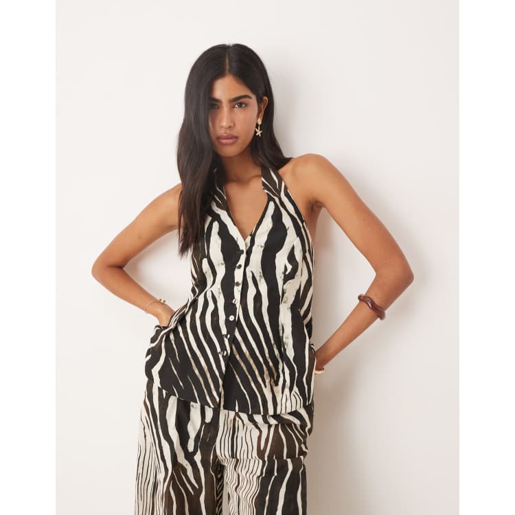 Top de sastre con cuello halter y estampado de cebra de Mango