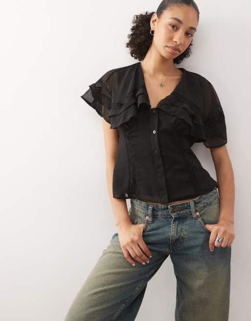 Top de tarde negro con solapas estilo capa de Reclaimed Vintage