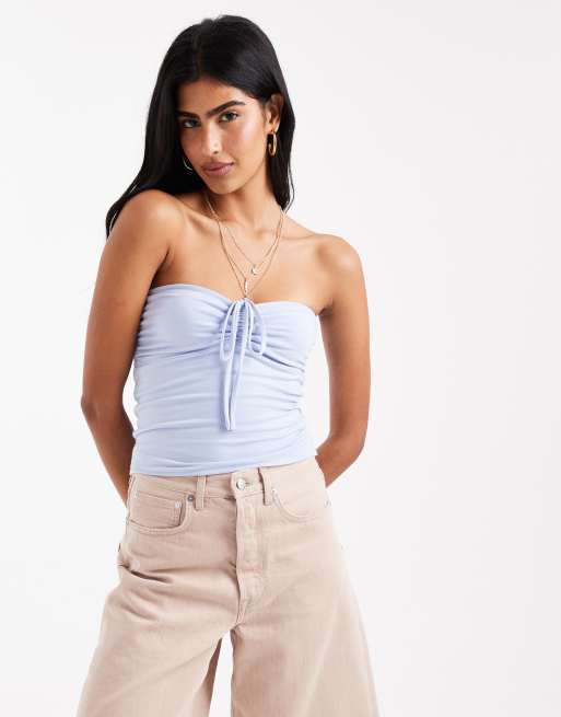 Top de tubo azul claro con cuello halter y lazada delantera de Hollister