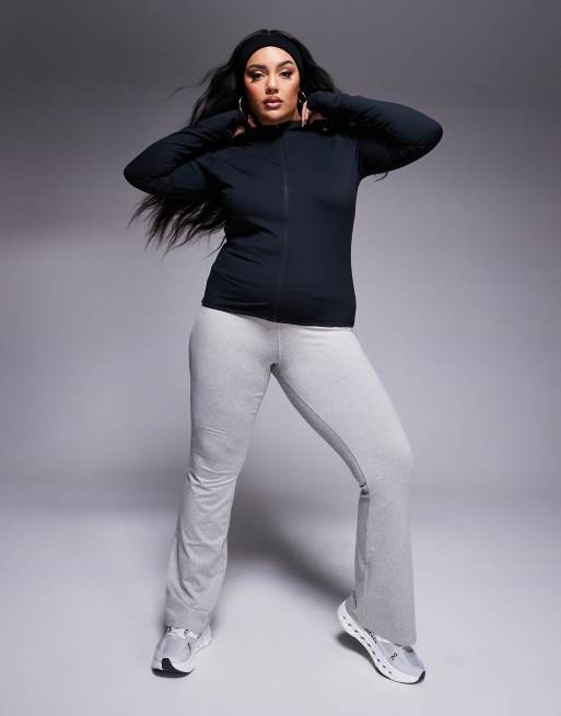 Top deportivo negro de manga larga con cremallera de tejido suave Icon de 4505 Curve 