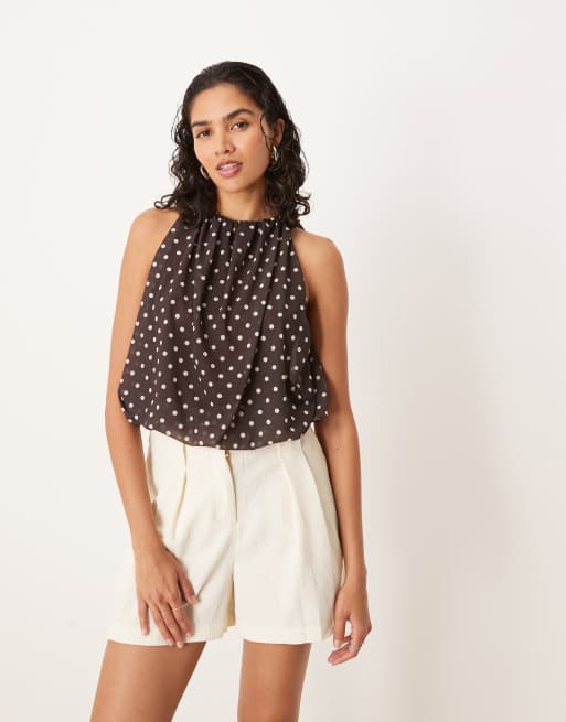 Top marrón con estampado de lunares, cuello halter y bajo abullonado de ASOS DESIGN