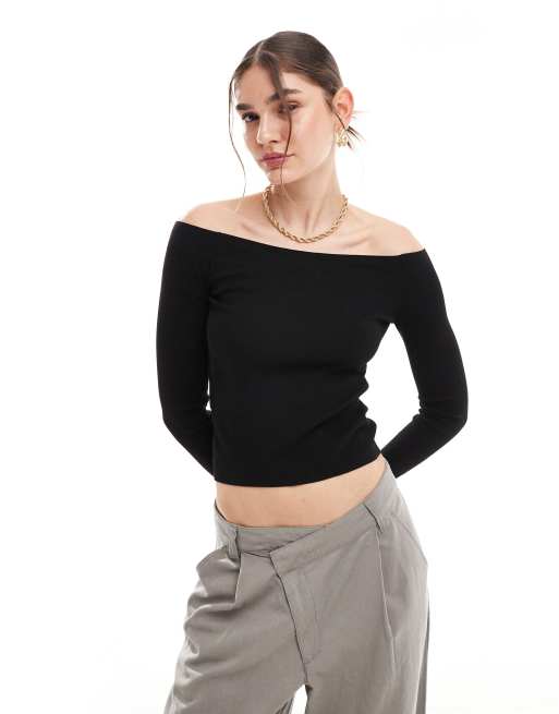 Top negro con escote Bardot de punto de Mango