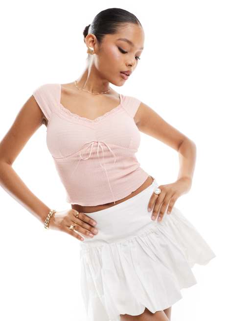Top rosa pastel de punto texturizado con detalle de lazo de Vero Moda