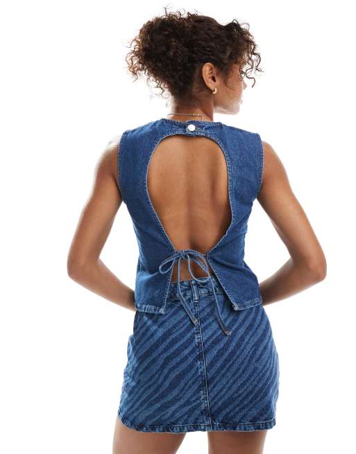 Top vaquero azul añil sin mangas con espalda descubierta con lazada de ASOS DESIGN