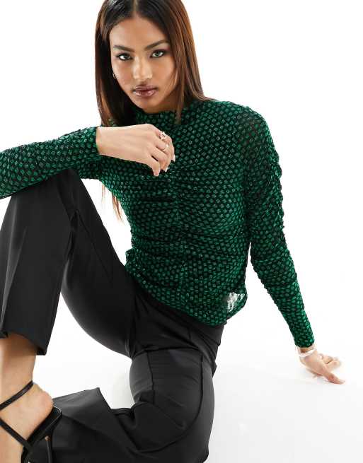 Top verde con cuello alto y acabado efecto purpurina de malla de Y.A.S