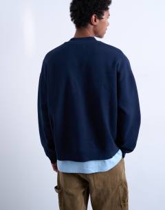 Model wearing 1/4 zip bomber in navy