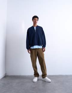 Model wearing 1/4 zip bomber in navy