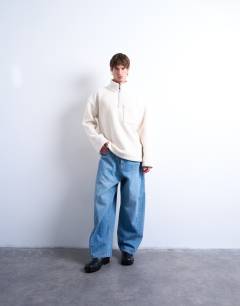 Model wearing 1/4 zip borg sweatshirt in ecru