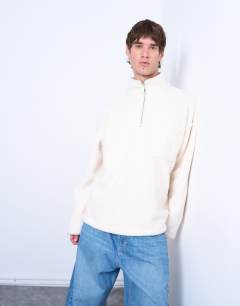 Model wearing 1/4 zip borg sweatshirt in ecru