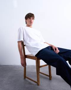 Model wearing 2 pack regular fit t-shirt in black and white
