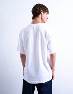 Model wearing 2 pack regular fit t-shirt in black and white