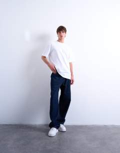 Model wearing 2 pack regular fit t-shirt in black and white