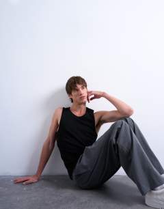 Model wearing 2 pack rib vest in black