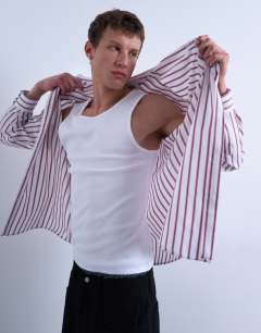 Model wearing 2 pack rib vest in white