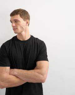 Model wearing 3 pack classic fit t-shirt in black, charcoal and burgundy