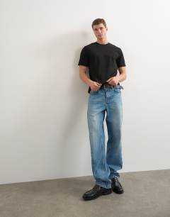 Model wearing 3 pack classic fit t-shirt in black, charcoal and burgundy