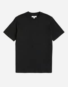 Model wearing 3 pack classic fit t-shirt in black, white and stone