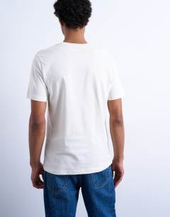 Model wearing 3 pack classic t-shirt in black, brown and ecru 