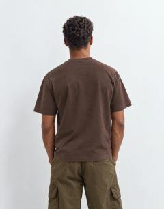 Model wearing 3 pack relaxed fit t-shirt in black, ecru and brown