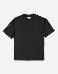 Model wearing 3 pack relaxed fit t-shirt in black, white and stone
