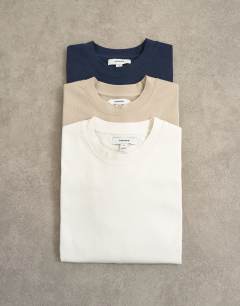 Model wearing 3 pack relaxed fit t-shirt in ecru, navy and stone